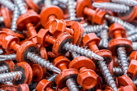 Many screws arranged as backgroundの写真素材