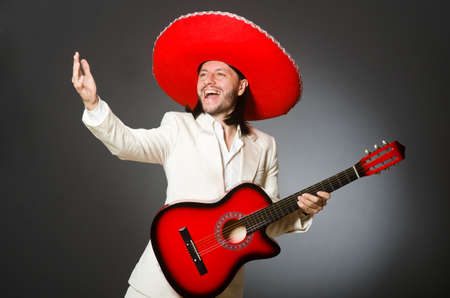 Young mexican guitar player wearing sombreroの写真素材