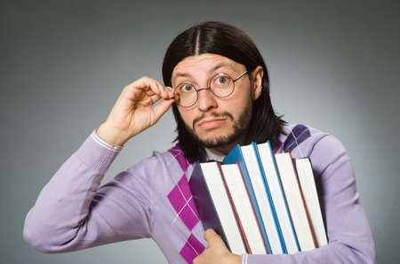 Young student with book in learning conceptの写真素材