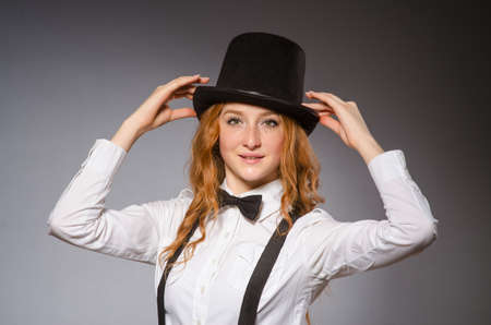 Red hair girl in classic style against grayの写真素材