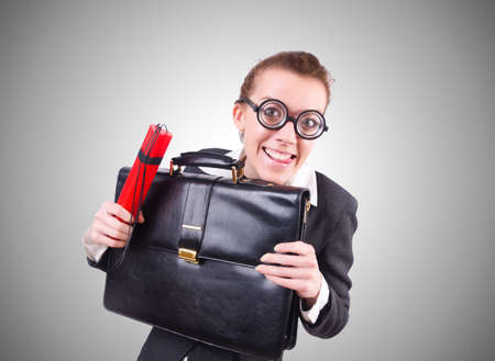Businesswoman with dynamite on whiteの写真素材