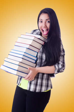 Girl student with books on whiteの写真素材