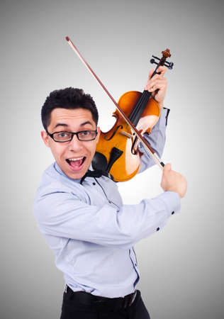 Funny man with violin on whiteの写真素材