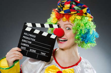Clown with movie clapper in funny conceptの写真素材