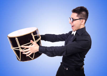 Funny man with drum on white