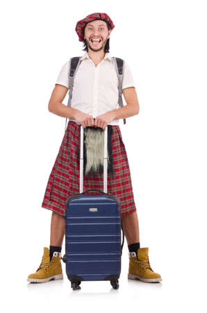 Man in scottish skirt with suitcase isolated on whiteの写真素材