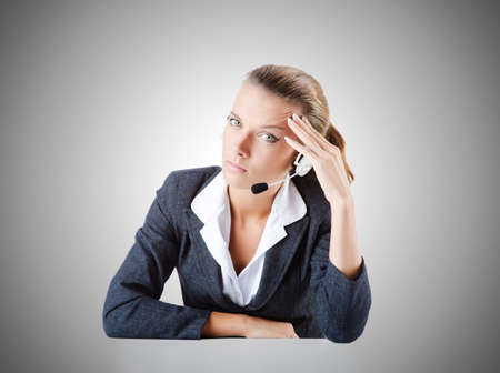 Female helpdesk operator on whiteの写真素材
