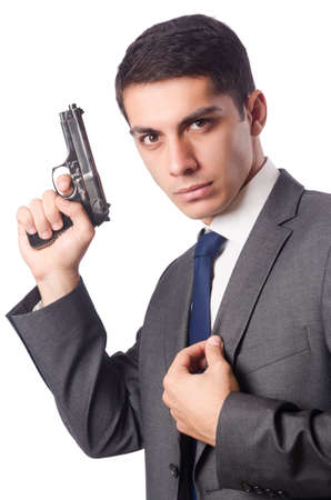 Businessman with gun isolated on whiteの写真素材
