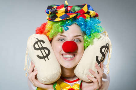 Clown with money bag in funny conceptの写真素材