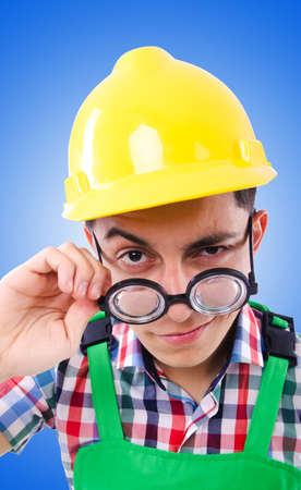 Funny construction worker isolated on whiteの写真素材