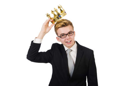 Young businessman with crown isolated on whiteの写真素材