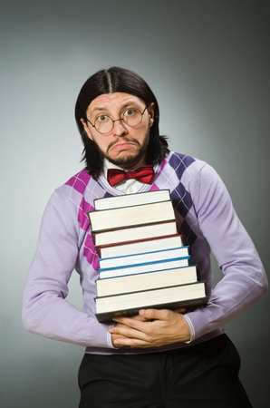 Young student with book in learning conceptの写真素材