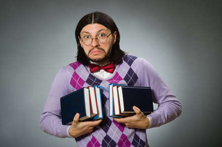 Young student with book in learning concept