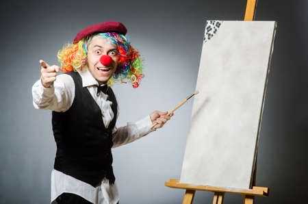 Funny artist in dark studioの写真素材