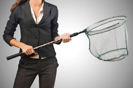 Woman with net isolated on whiteの写真素材