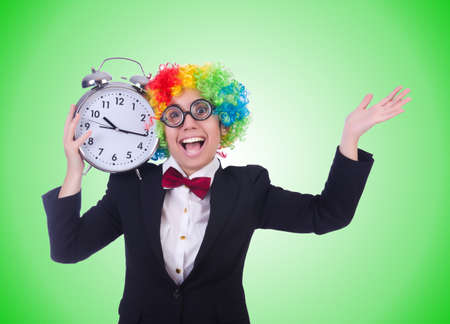 Funny clown with clock on whiteの写真素材