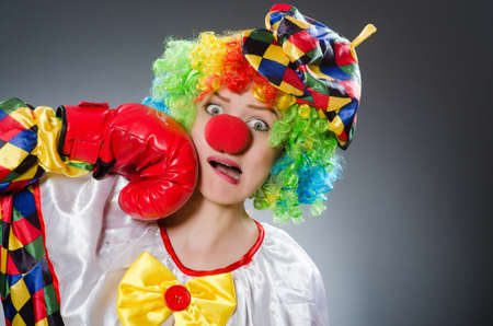 Clown with boxing gloves in funny conceptの写真素材