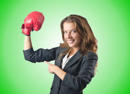 Young businesswoman in boxing conceptの写真素材