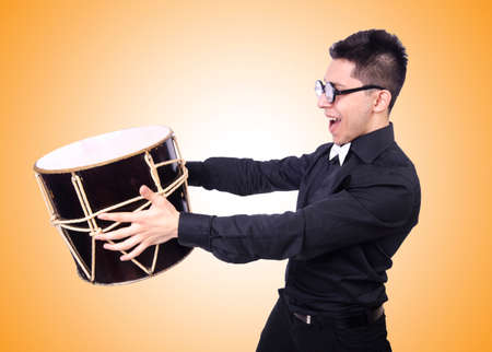 Funny man with drum on whiteの写真素材