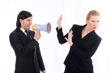 Businessman and businesswoman with megaphone isolated on whiteの写真素材