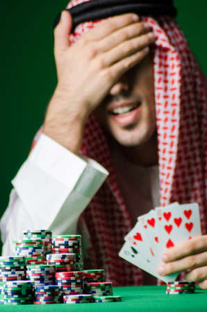 Arab man playing in the casinoの写真素材