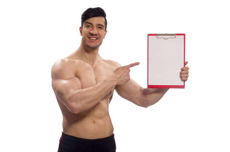 Muscular man with blank pad for your messageの写真素材