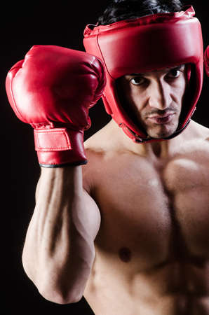 Muscular man in boxing conceptの写真素材