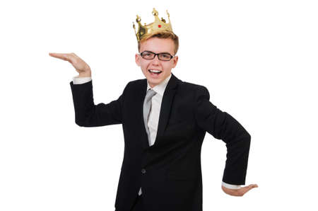 Young businessman with crown isolated on whiteの写真素材