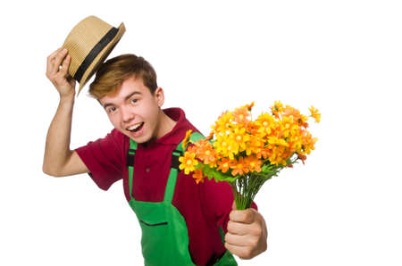 Young gardener with flower isolated on whiteの写真素材