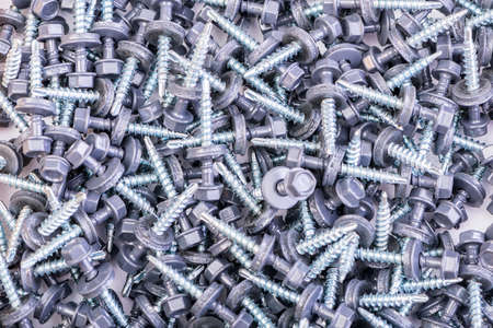 Many screws arranged as backgroundの写真素材