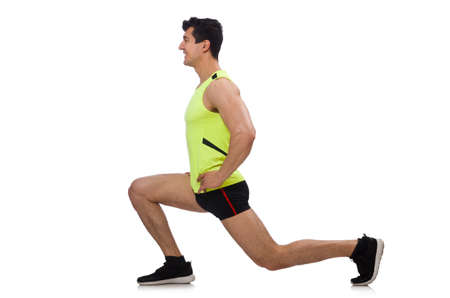 Young man exercising on white