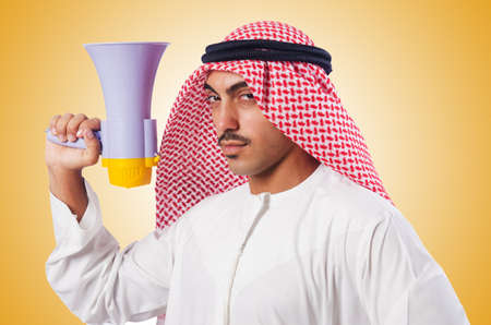 Arab man shouting through loudspeakerの写真素材