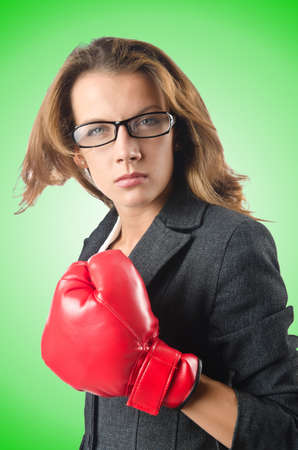 Young businesswoman in boxing conceptの写真素材