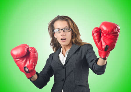 Young businesswoman in boxing conceptの写真素材