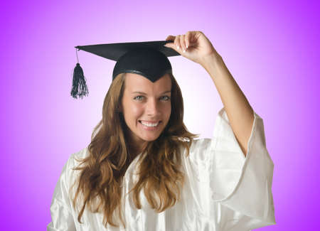 Young student with diploma on whiteの写真素材