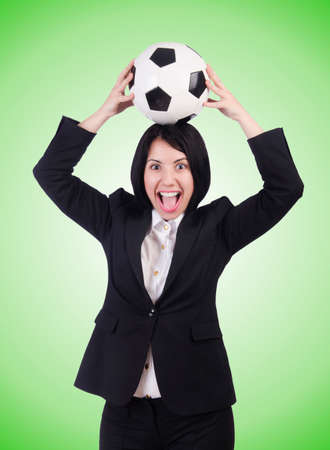 Businesswoman with ball on whiteの写真素材