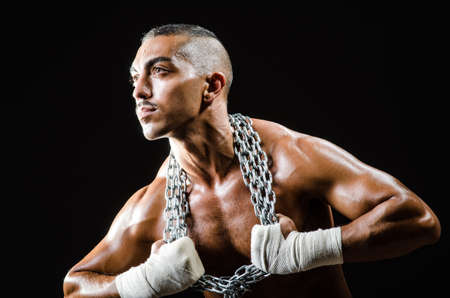 Muscular man with metal chain