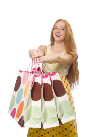 Woman with shopping bags isolated on whiteの写真素材