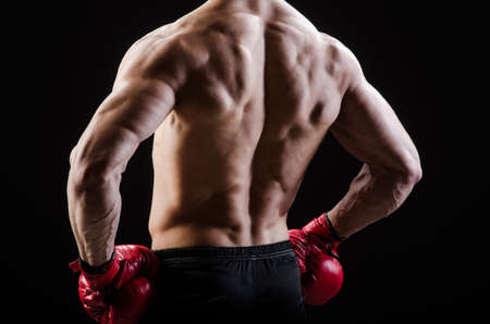 Muscular man in boxing conceptの写真素材