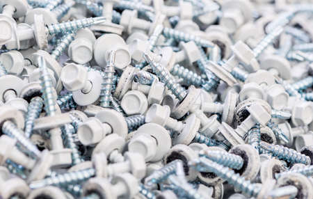 Many screws arranged as backgroundの写真素材