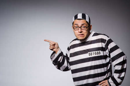 Young prisoner against grayの写真素材