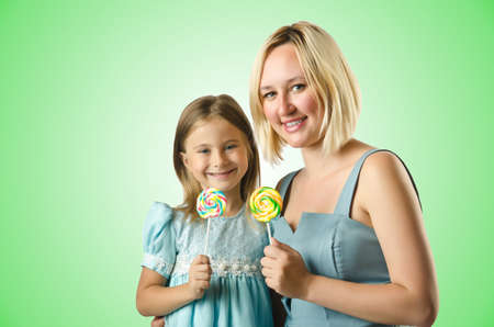 Mother with daughter isolated on whiteの写真素材