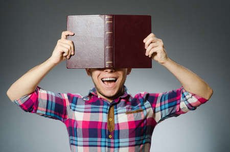 Funny student with many books