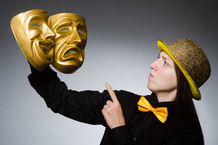 Woman with mask in funny conceptの写真素材