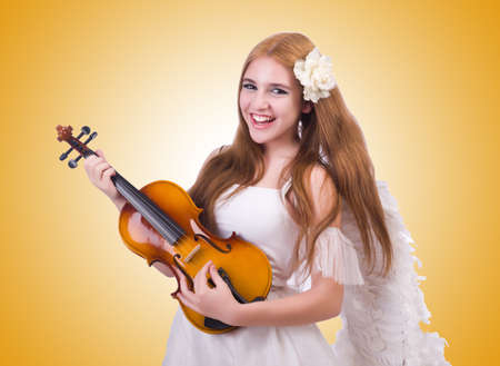 Young violin player isolated on whiteの写真素材