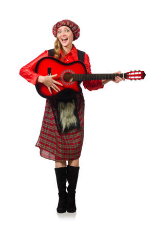 Funny woman in scottish clothing with guitarの写真素材