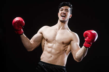 Muscular man in boxing conceptの写真素材