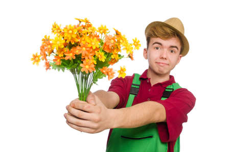 Young gardener with flower isolated on whiteの写真素材