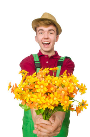 Young gardener with flower isolated on whiteの写真素材
