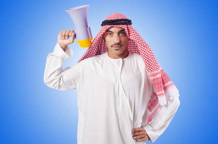 Arab man shouting through loudspeakerの写真素材